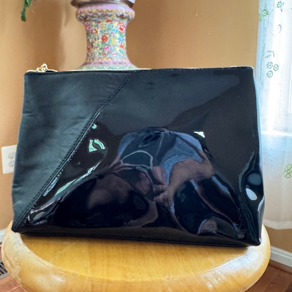 YSL Logo Embossed Faux Leather Beaute Pouch Cosmetic Bag. YSL
Logo Zipper Pull